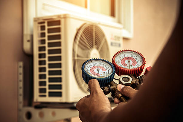 Professional Air Conditioning Service technician working in Lewisburg, TN